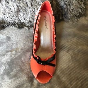 Peach with black trim heels.